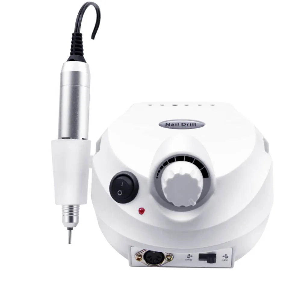 Nail 202 sander in pink with handpiece, foot switch, and grinding heads on a white background