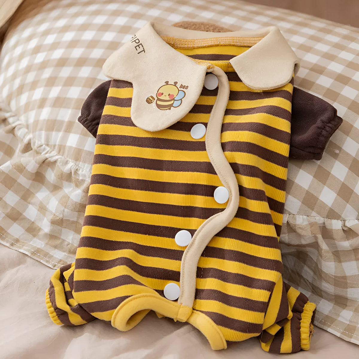 Yellow bee-patterned dog pajamas on small dog, four-legged full coverage suit with lapel collar