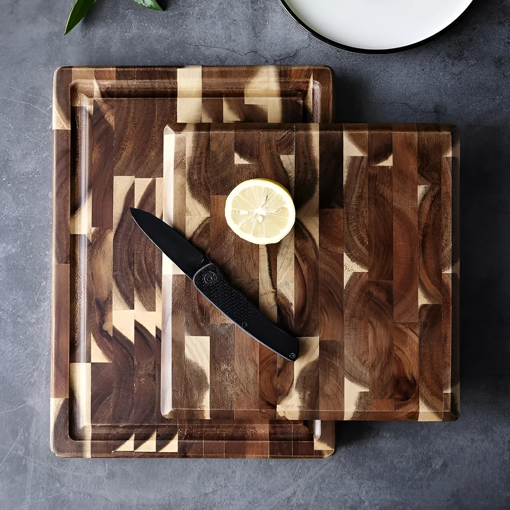 Brown parquet pattern solid acacia wood chopping board on a kitchen counter.