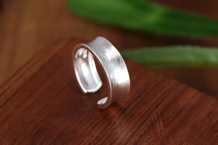 Adjustable open ring with geometric design and frosted sterling silver finish