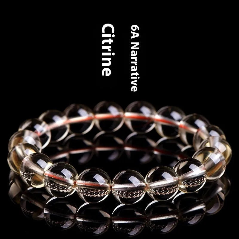 Natural citrine scattered beads ball bracelet showing polished stones and original design on wrist.