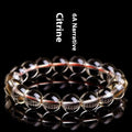 Natural citrine scattered beads ball bracelet showing polished stones and original design on wrist.