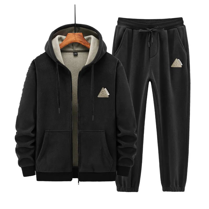 Grey men's casual sports suit with hooded sweater and matching trousers laid flat.