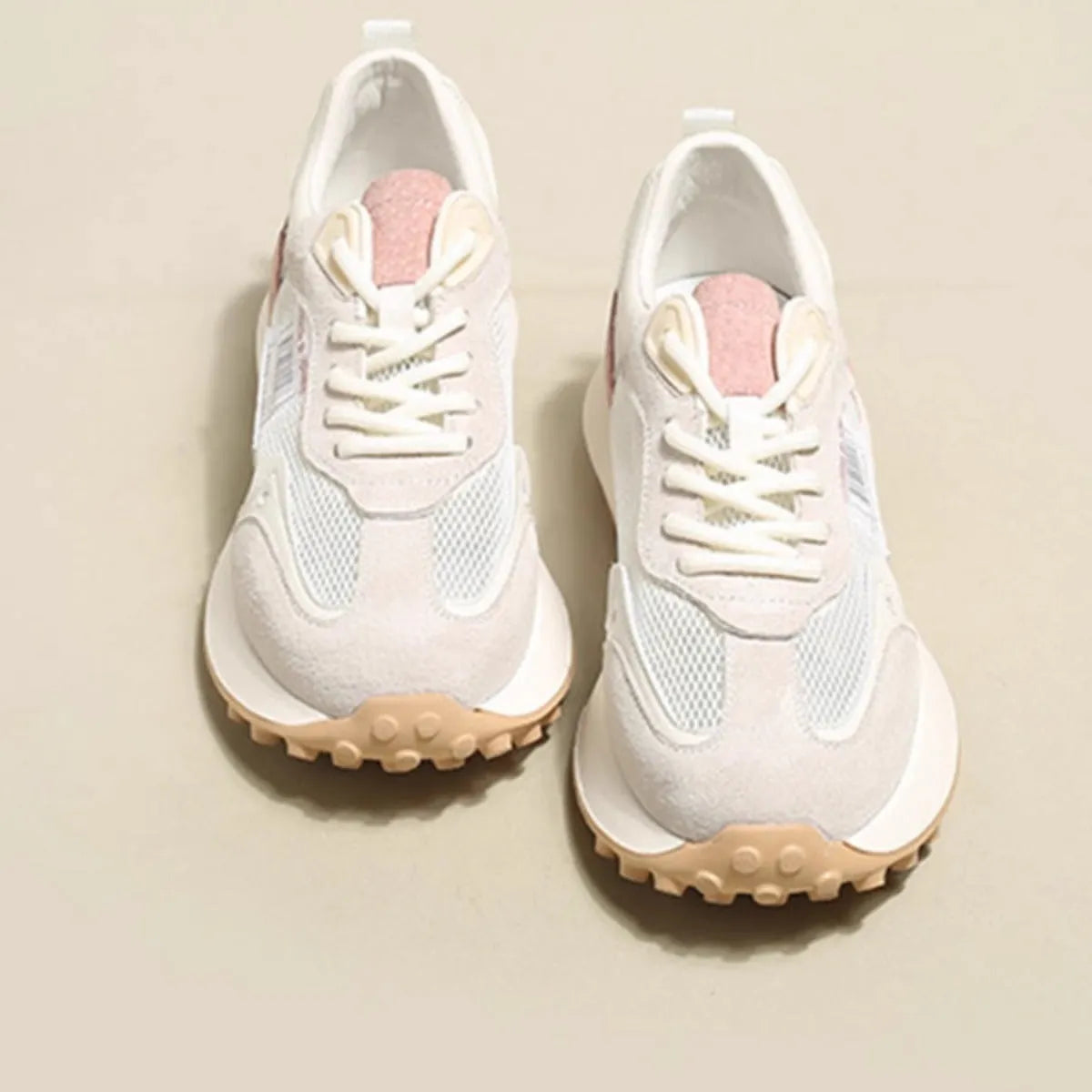 Women's grey and pink low-top retro sneaker with round toe and flat rubber sole