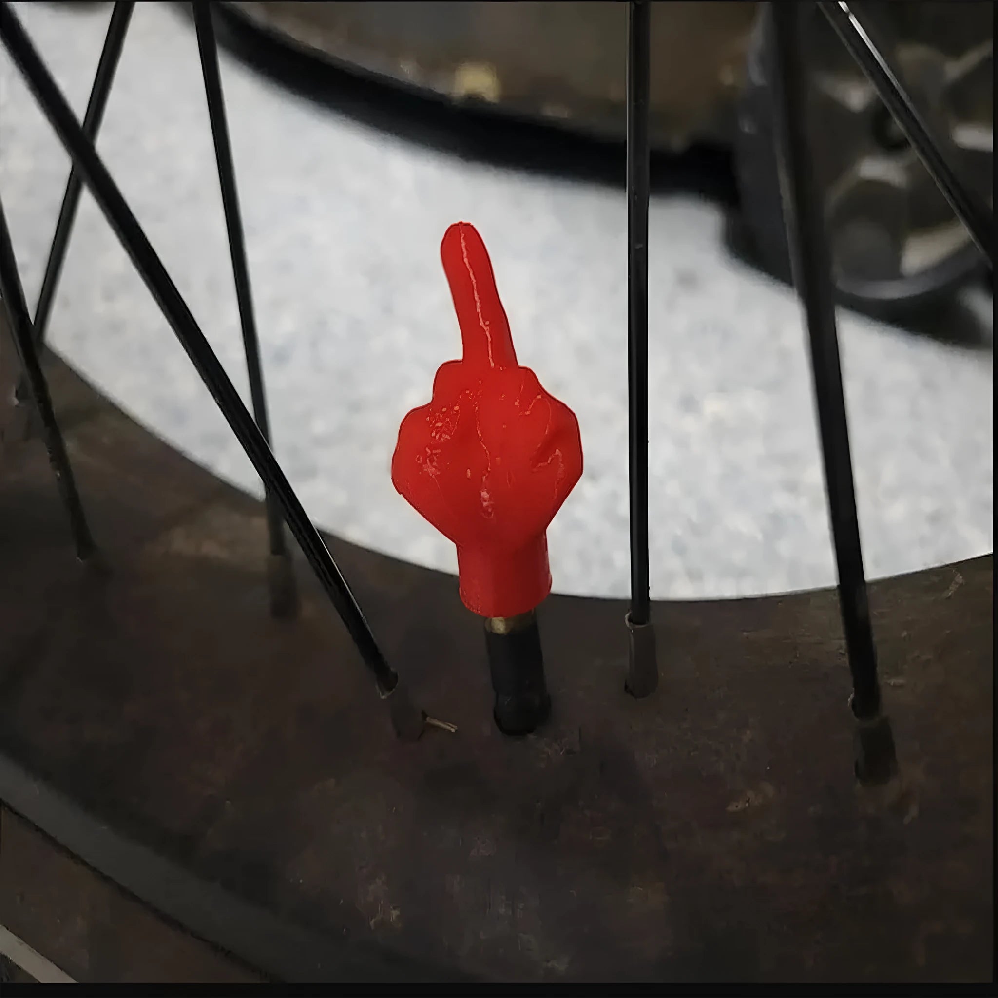 Four latex tyre valve caps shown in skin colour and black colours for dust protection