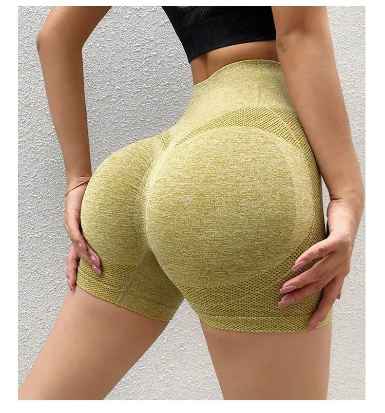 Women wearing high-waist seamless yoga shorts in black performing fitness exercises