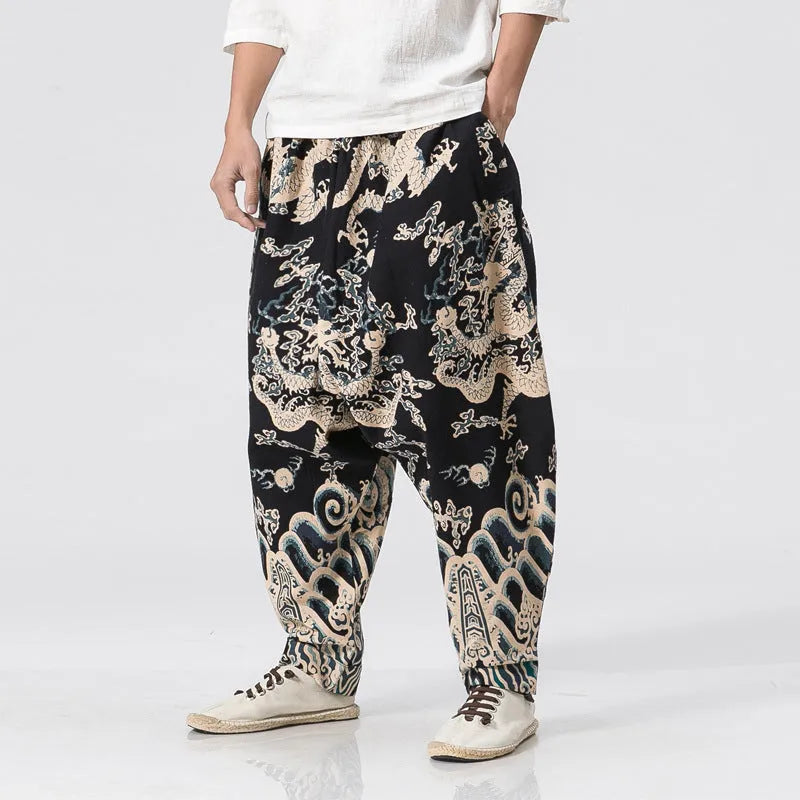 Men's hip hop cross pants with dragon print pattern and elastic waist in loose harem style.