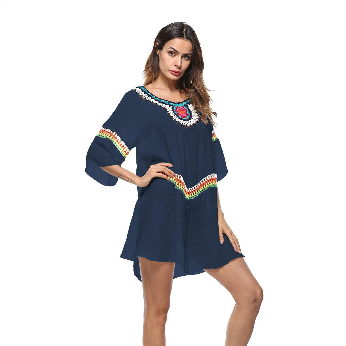 Women's crocheted ethnic style beach cover-up for sun protection, shown in apricot colour
