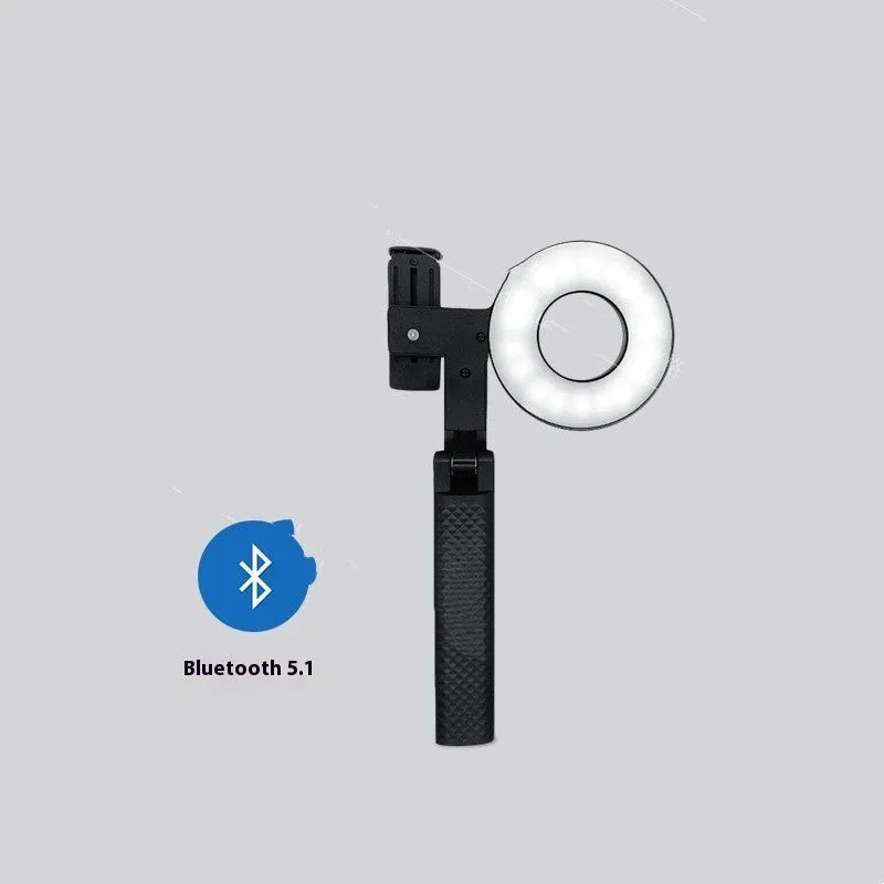 Black handheld LED fill light for mobile phone photography showing portable design