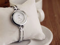 Rhinestone vintage watch bracelet with round dial, metal case, and alloy strap in gold or silver