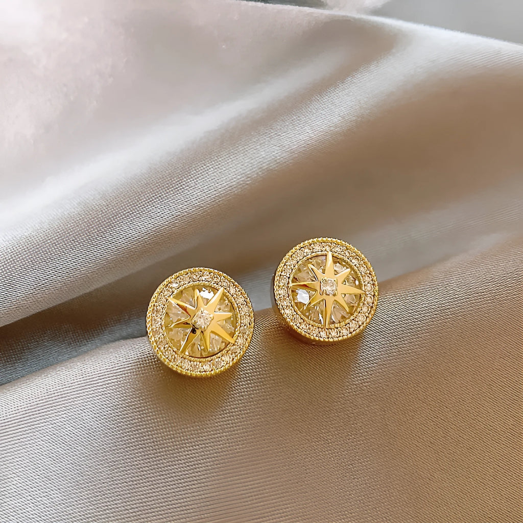 Pair of copper stud earrings with real gold plating and inlaid zircon in an eight-pointed star shape for women