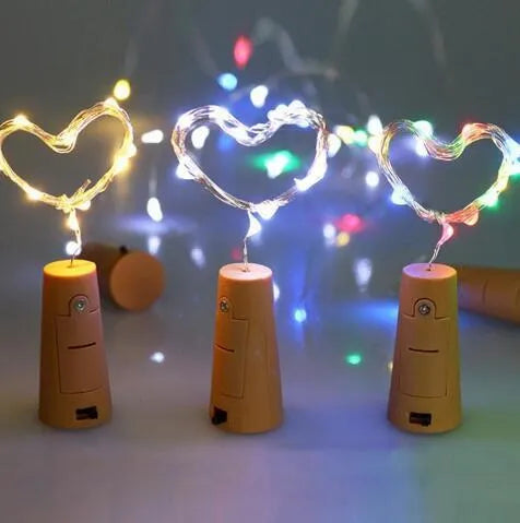 Silver copper wire LED string light with bottle stopper for decorative lighting.