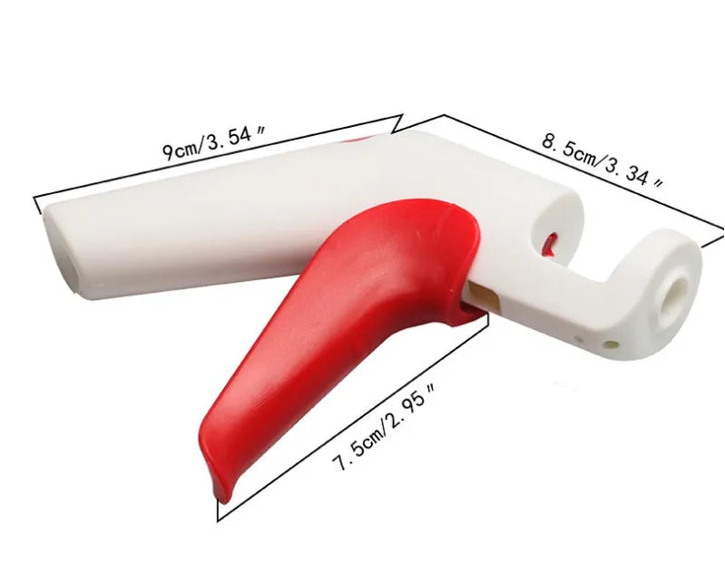 Manual cherry pitter tool with stainless steel coring mechanism on a kitchen worktop.