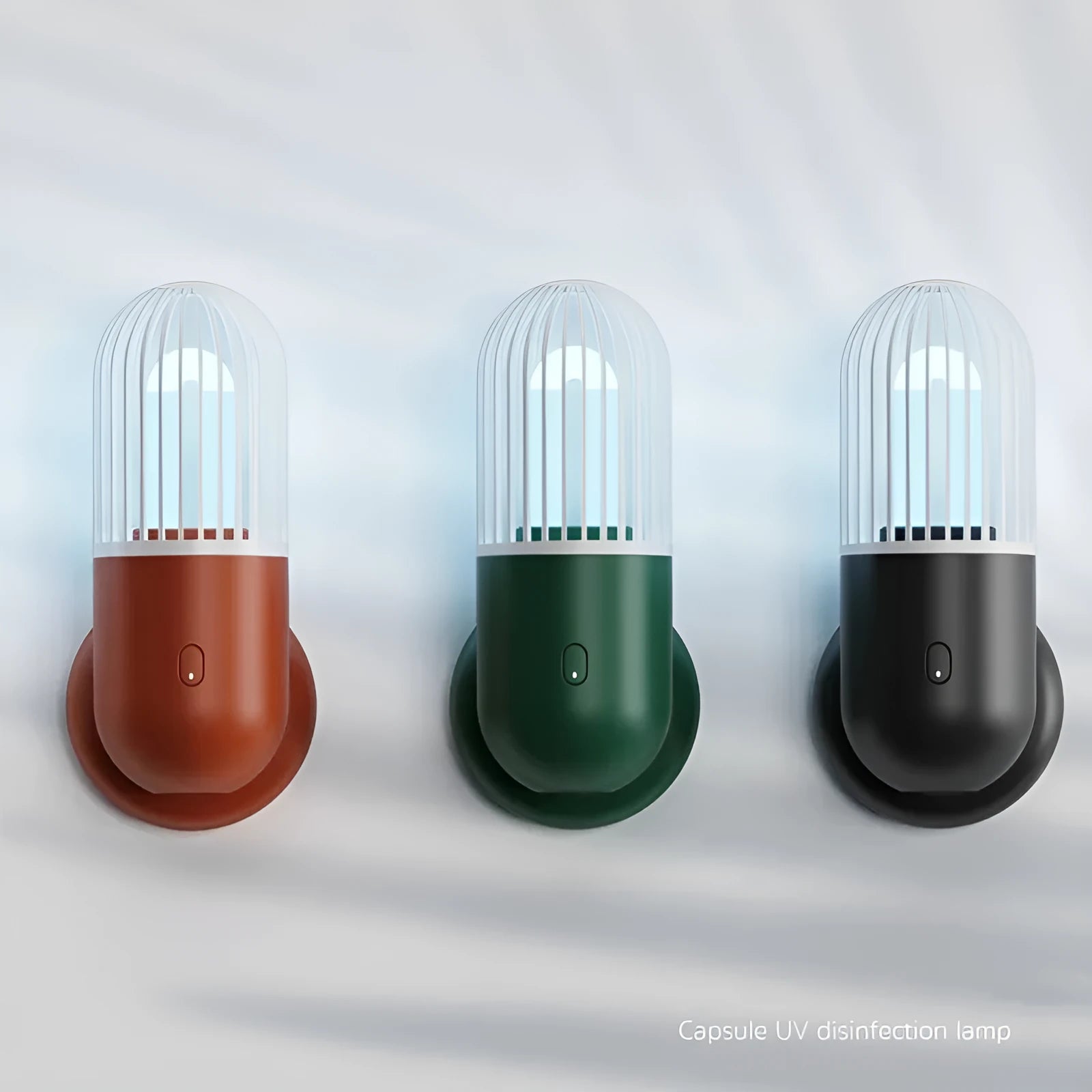Portable capsule-shaped UVC disinfection lamp in black, showing compact size.
