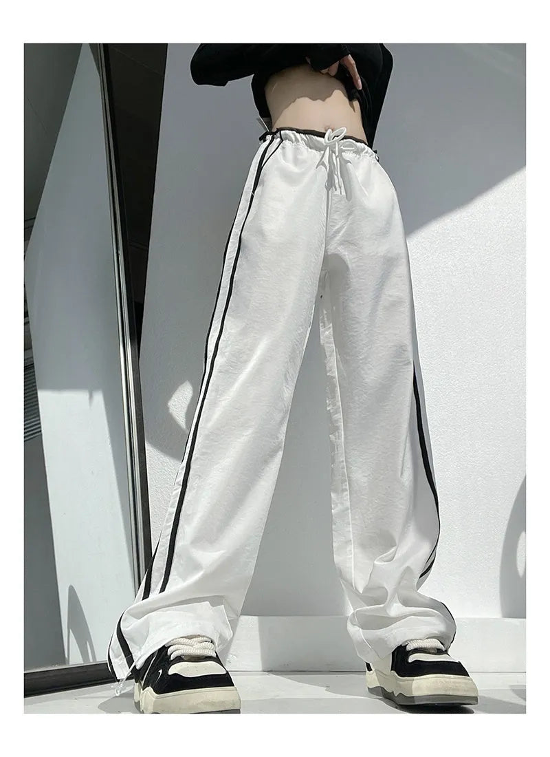 Women's loose straight-leg trousers with contrast ribbon parallel bars detail in navy blue