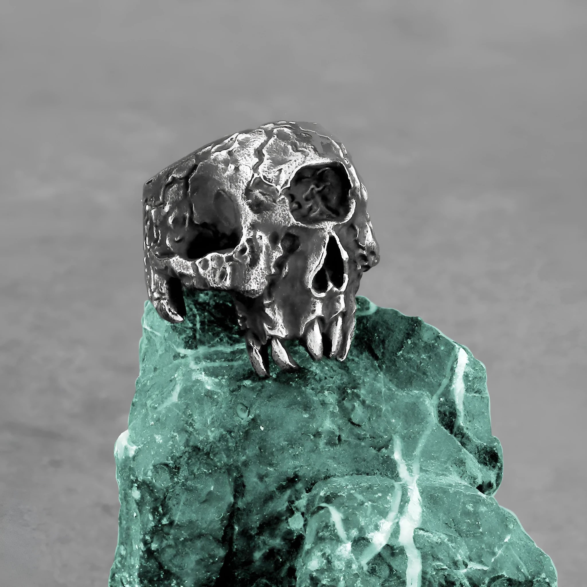 Alloy ring with electroplated finish showing one-eyed skull design in retro punk style