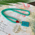 Turquoise mesh flower lucky pendant necklace with adjustable ball bead chain, hand-woven design detail shown