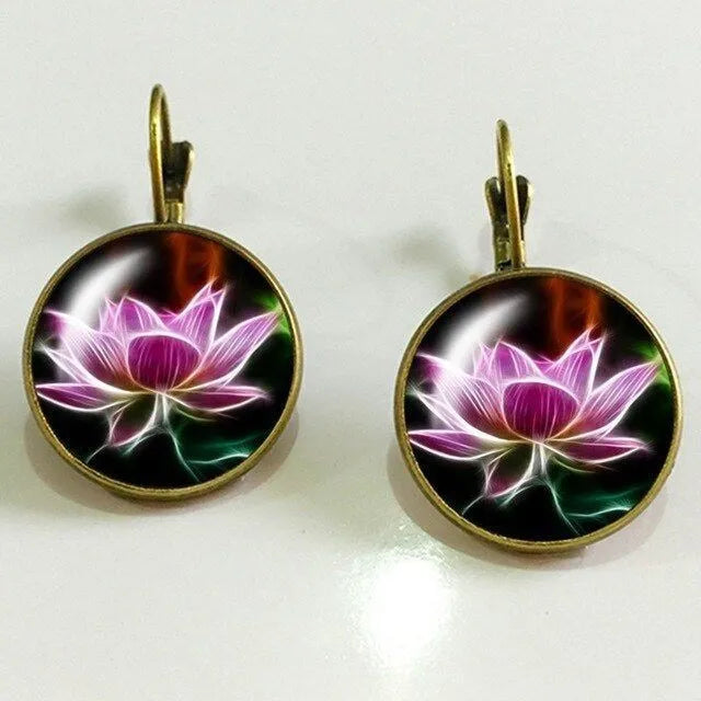 Silver alloy geometric big earring with electroplated gold and sapphire finish on white background