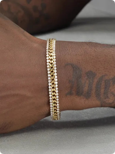 Gold tennis bracelet with artificial gemstone inlay on wrist, showing hip hop style unisex design