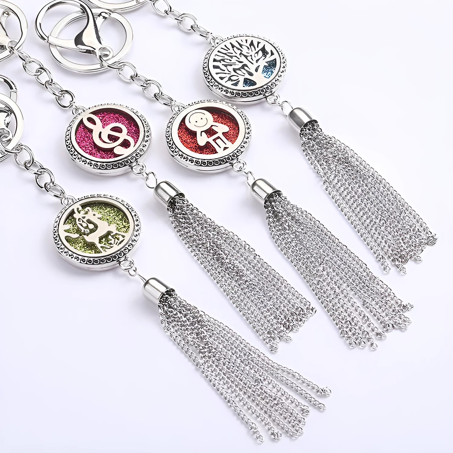Alloy metal car fragrance pendant with tassel on a 50cm chain, shown with scented cotton pieces.