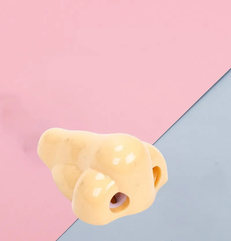 Plastic geometry-shaped manual pencil sharpener in flesh colour measuring 58x45x30mm