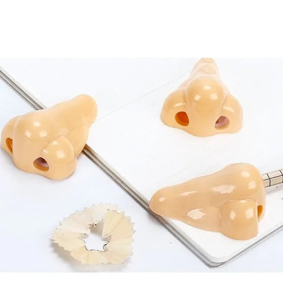 Plastic geometry-shaped manual pencil sharpener in flesh colour measuring 58x45x30mm