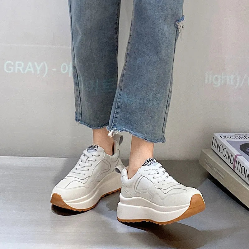 Women's beige cowhide leather casual sports shoes with round toe and cross-strap detail.