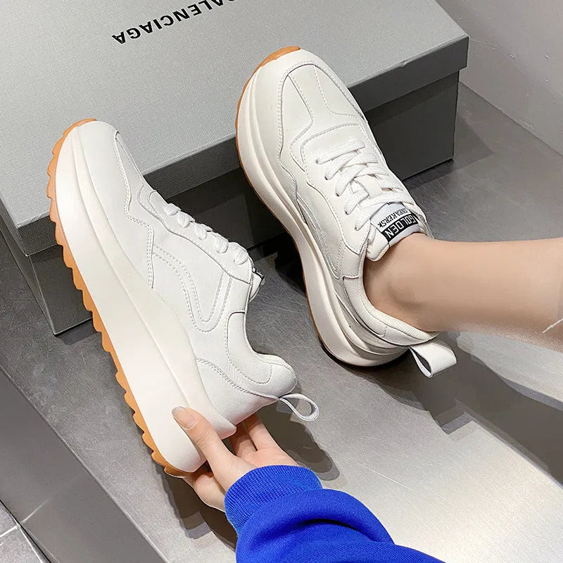 Women's beige cowhide leather casual sports shoes with round toe and cross-strap detail.