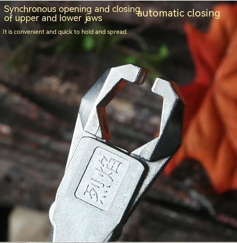 Close-up of a zinc alloy two-axis harpoon clip release aid with stainless steel mechanism.