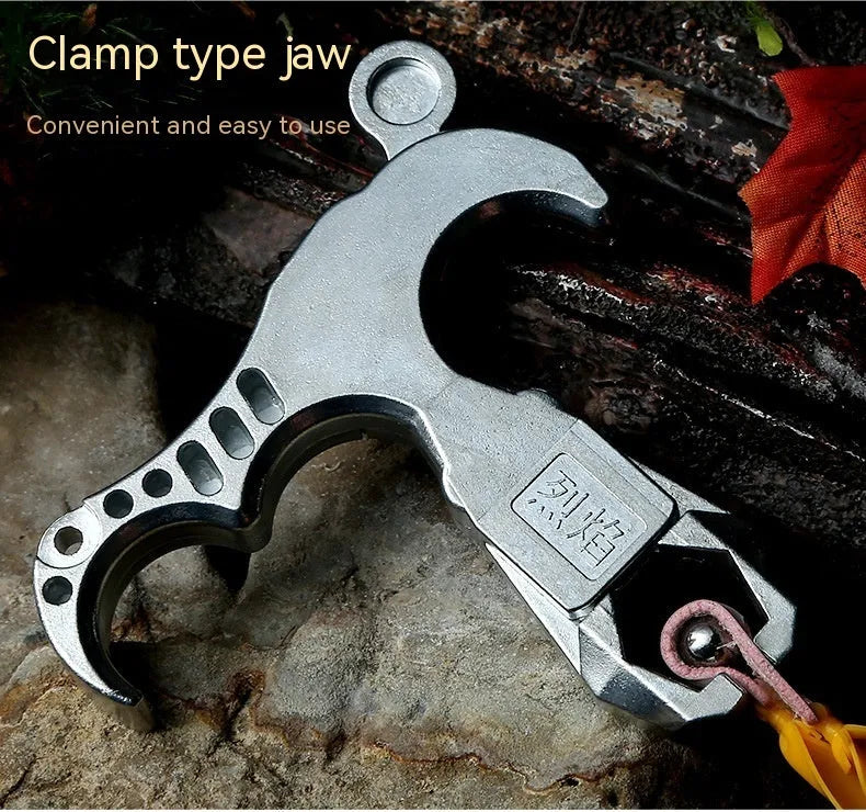 Close-up of a zinc alloy two-axis harpoon clip release aid with stainless steel mechanism.