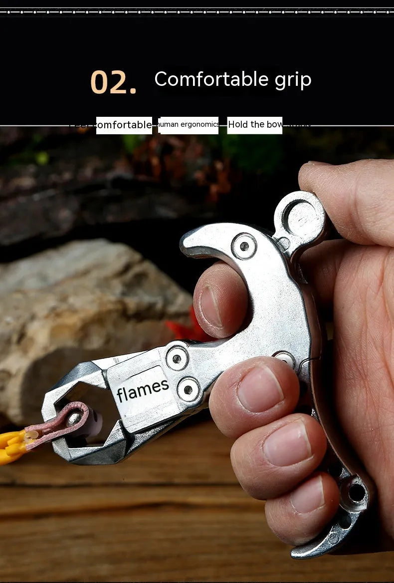 Close-up of a zinc alloy two-axis harpoon clip release aid with stainless steel mechanism.