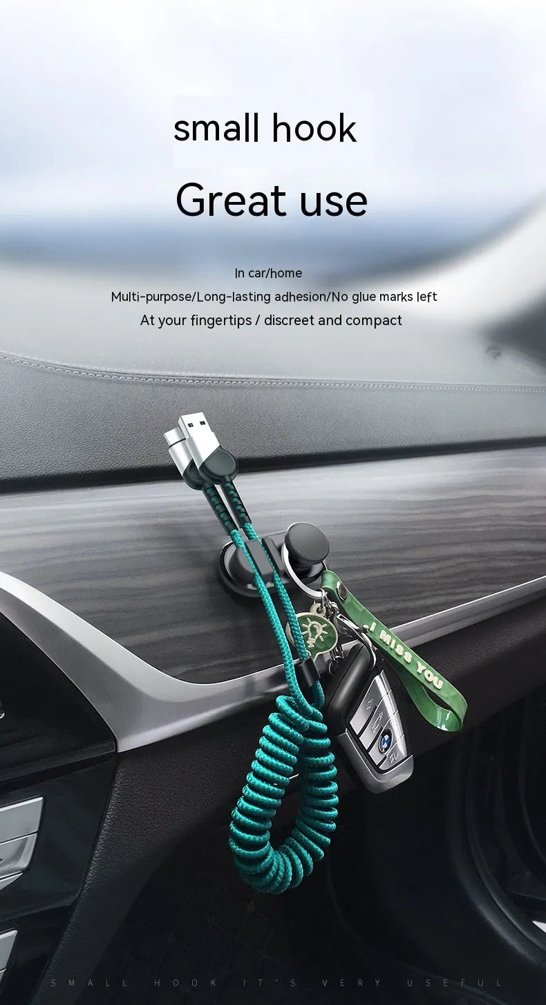 Car data cable storage hook in dark green with adhesive mount for vehicle interiors