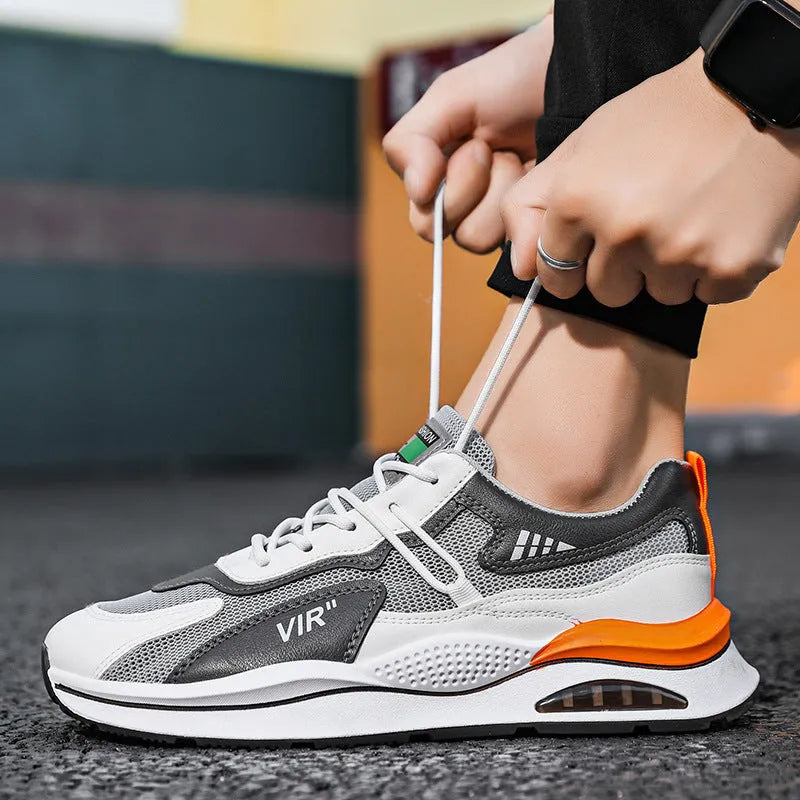 Men's grey breathable mesh running shoes with a round toe and lightweight EVA sole.
