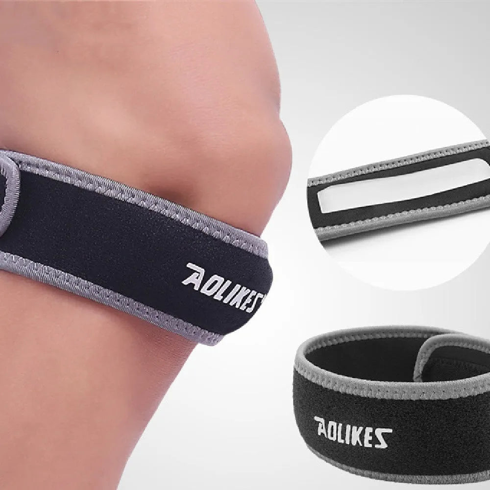 Black and grey patella retinaculum knee support for running and sports protection.