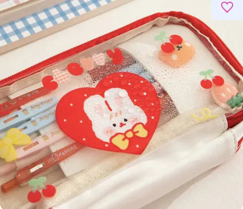Transparent TPU pen bag with cartoon rabbit design in pink or red colour options.