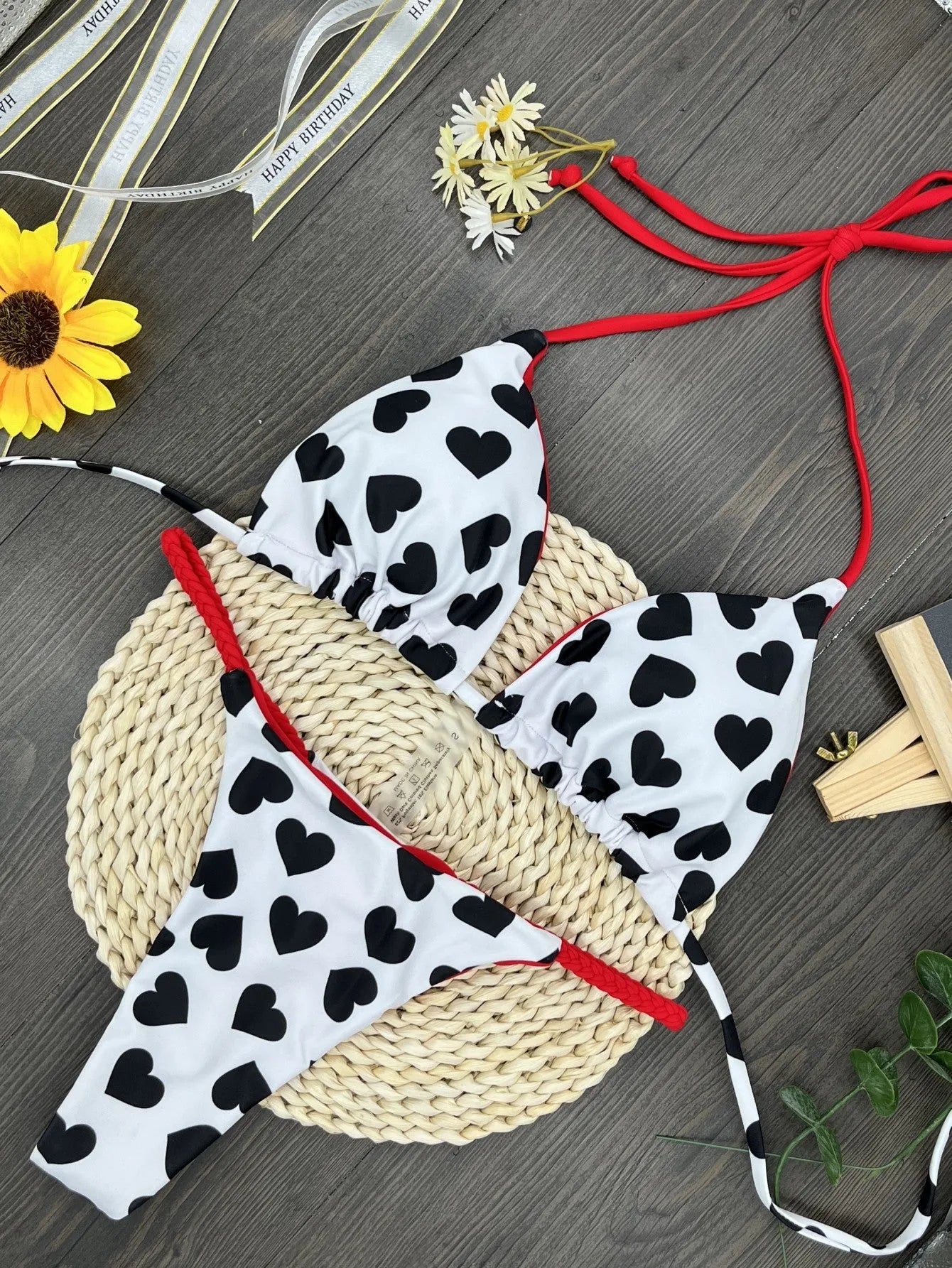 Women's red heart print backless one-piece swimsuit with a side split.