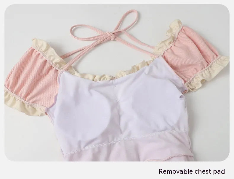 Women's pink conservative one-piece swimsuit with Siamese styling in nylon fabric