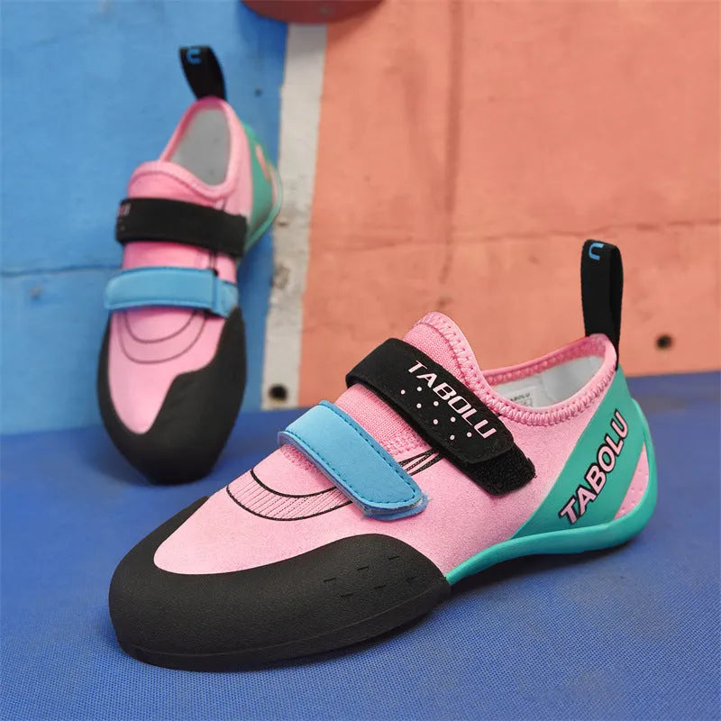 Beginner rock climbing shoes with Velcro straps and non-slip rubber soles in black/red colour
