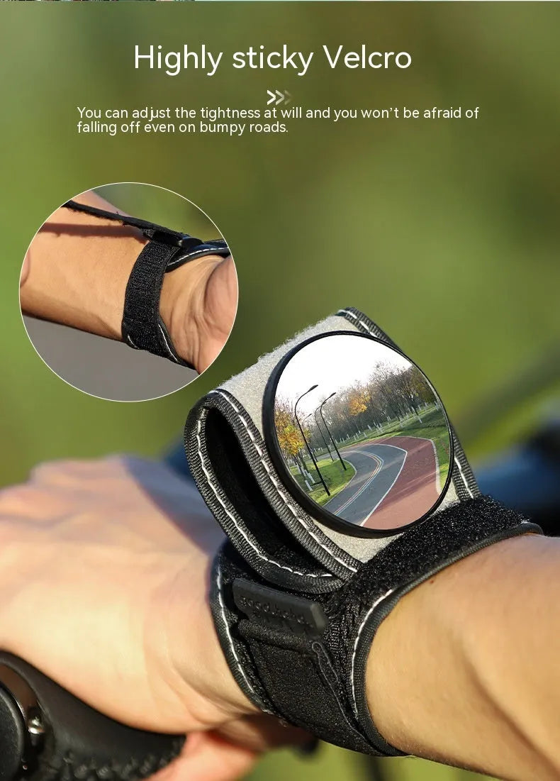 Black wrist-mounted bicycle rear-view mirror with adjustable nylon strap for cycling safety