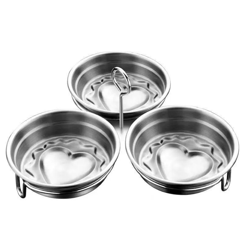 Stainless steel mini egg cooker with a heart-shaped mould and a round mould for steaming eggs.