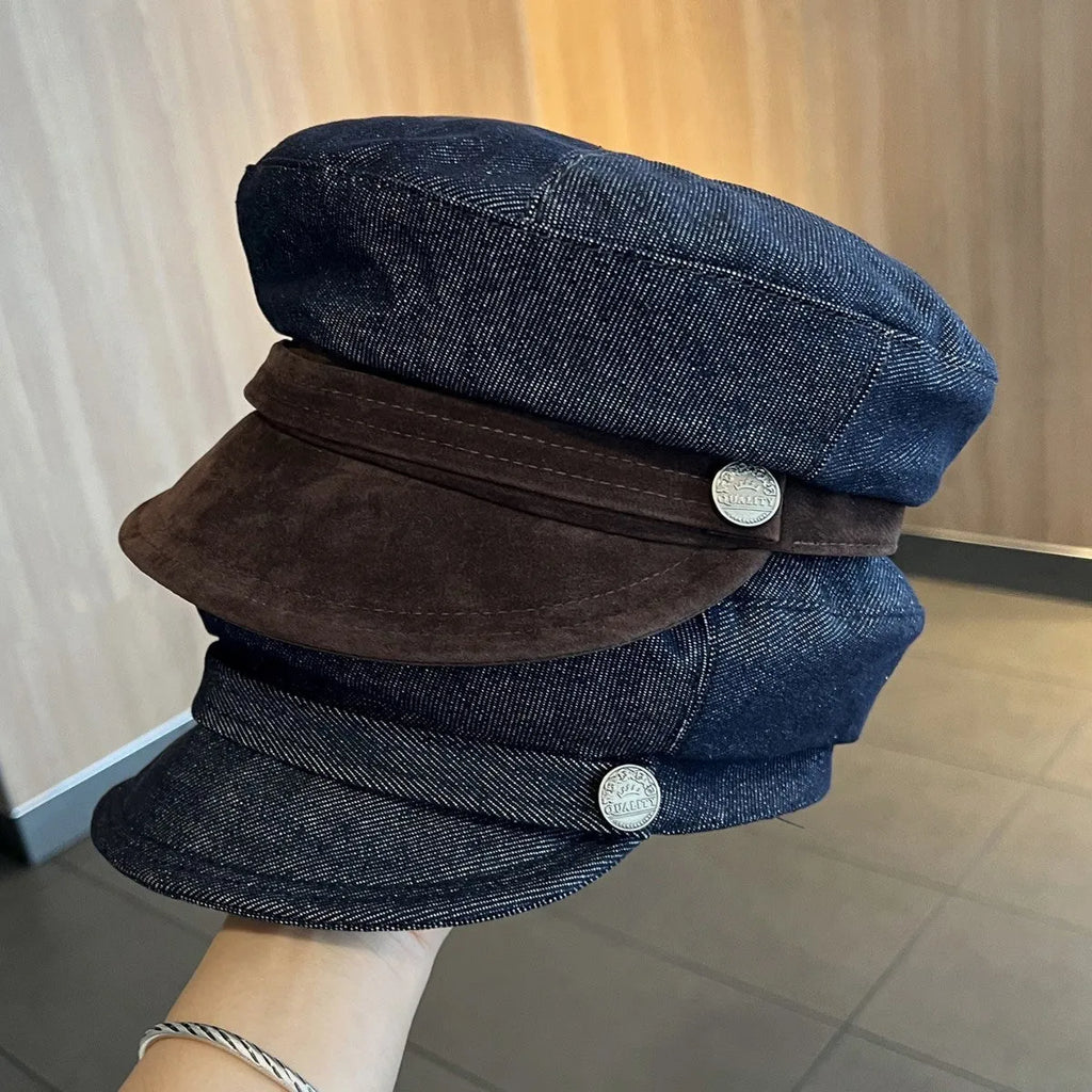 Dark blue denim adjustable octagonal newsboy cap shown on a neutral background.