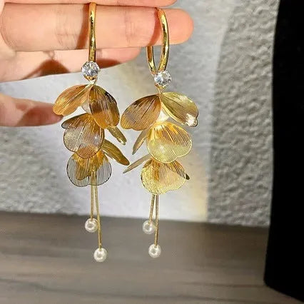 Floral petal pearl fringe earrings in gold with electroplated alloy and tassel drop design