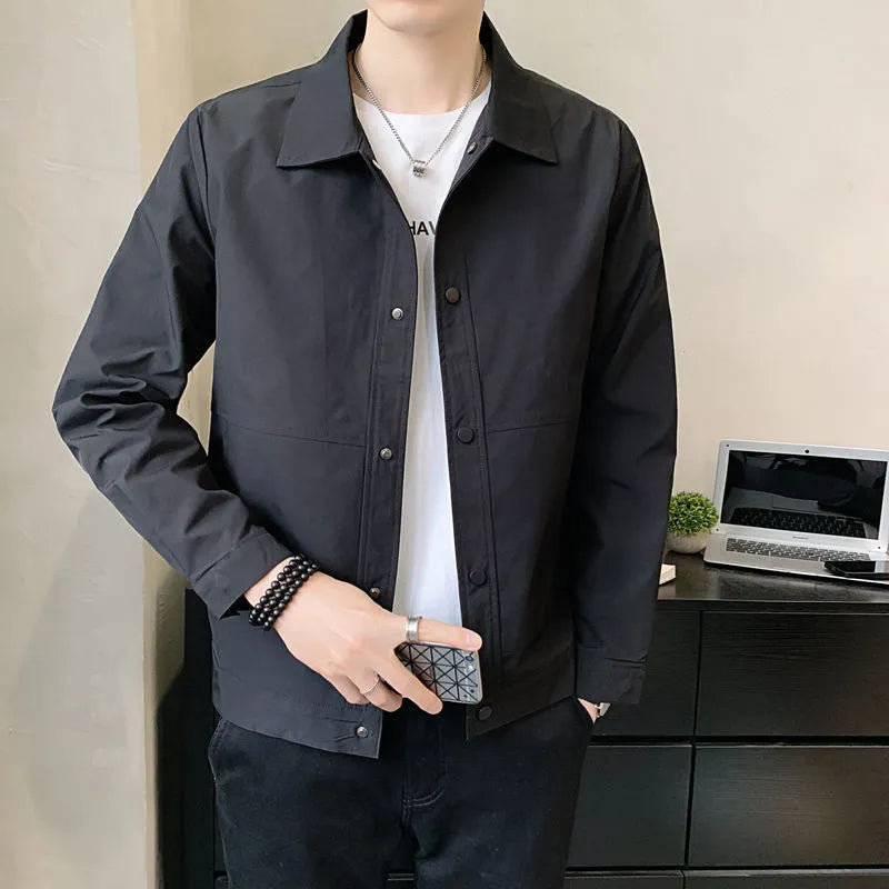 Man wearing a lightweight grey single-layer Korean-style jacket for spring or autumn.