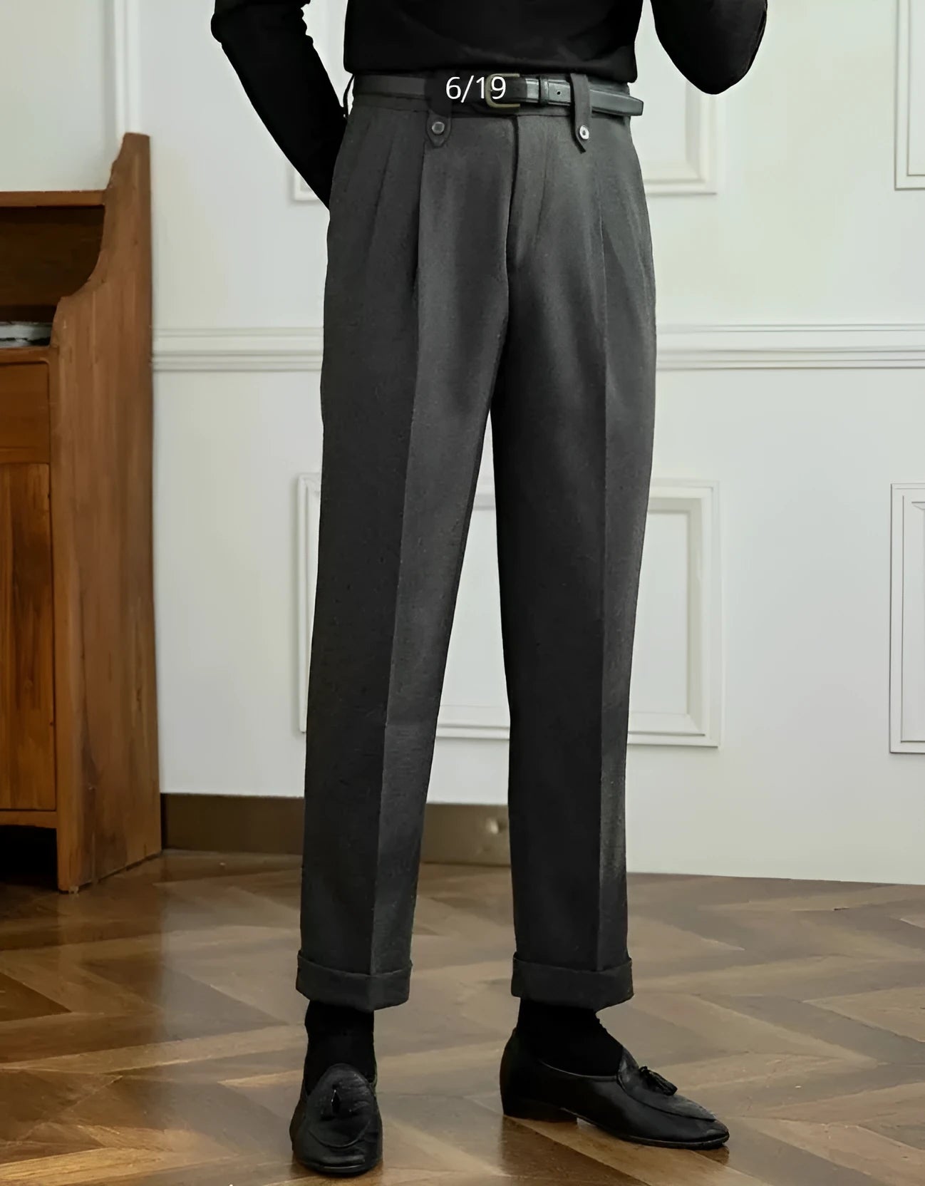 Grey straight-leg casual trousers with a high waist on a hanger.