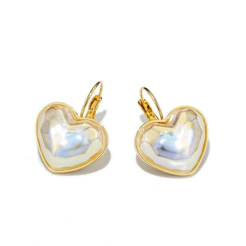 Pair of gold-coloured alloy clip-on earrings with a fashion niche design for women.