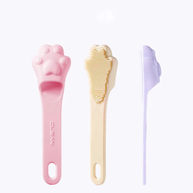 Silicone finger cover toothbrush for pet dental cleaning in pink, purple, and yellow colours.