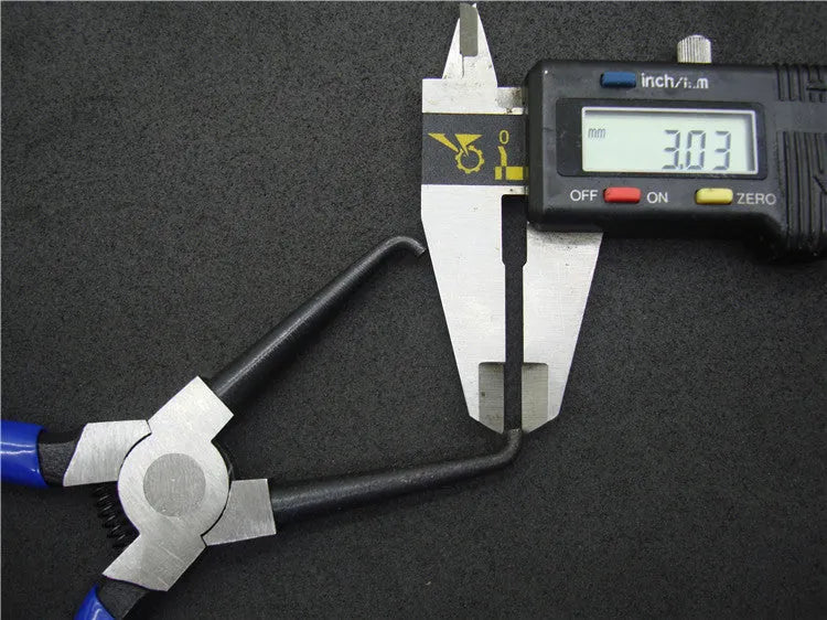 Automotive caliper tubing pliers with iron construction and rubber grips for fuel line maintenance