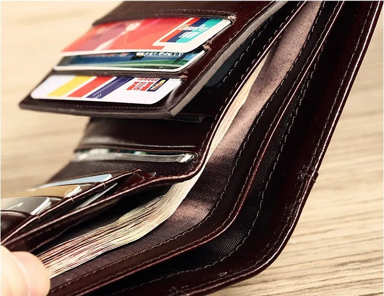 Men's leather wallet showing multiple internal compartments including photo slot and card holders