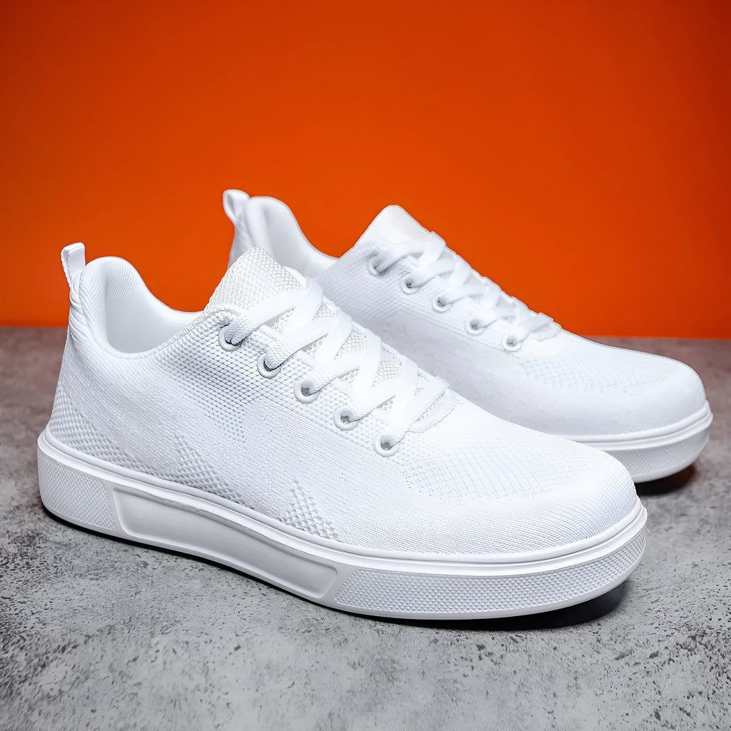 Light white thick sole casual sports shoes with mesh upper and lace-up front.