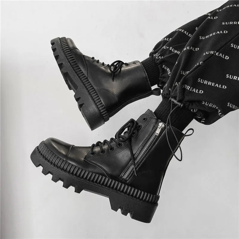 Men's black platform boots with frosted cowhide upper and a side zipper, shown on a size label.